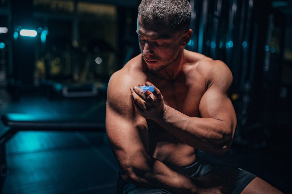 Man injecting steroids in shoulder